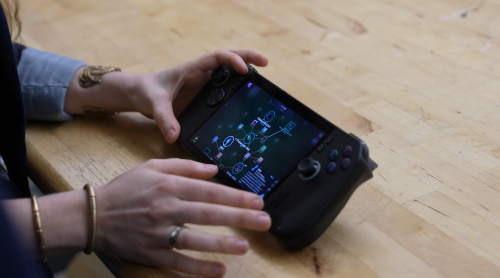 A closeup of hands using an ROG ALLY handheld